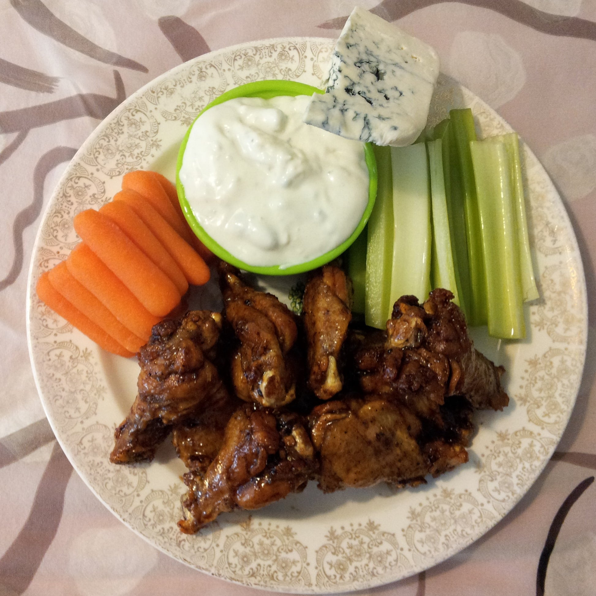 Balsamic Wings on a plate with carrots, celery and blue cheese.  
A delicious alternative for wings!!  Step out of the box and try my incredibly addictive Balsamic Wings for your next party and you may never eat Buffalo wings or wing dings again.  After cooking toss with tossed with Chef Tim's Sweet Balsamic Vinaigrette salad dressing and marinade.  Made with 7 natural Ingredients and is Gluten Free & Cholesterol Free & No MSG