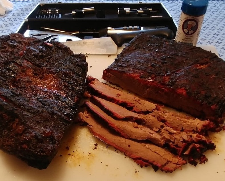 Sliced smoked brisket on a cutting board with a grill in the background.  seasoned with Chef Tim's Savory All Purpose Seasoning. A delightful blend of spices for beef, pork, chicken, seafood, veal & lamb, including roasts, steaks, chops, loins, fillets, and burgers. Also great on roasted potatoes, fries, pizza, vegetables & soups.
"Anything that walked, swam flew or grew."
Gluten Free & Cholesterol Free & No MSG
Great as a Gift for anyone who loves to Cook, Grill or use in the Smoker. Made in USA. 