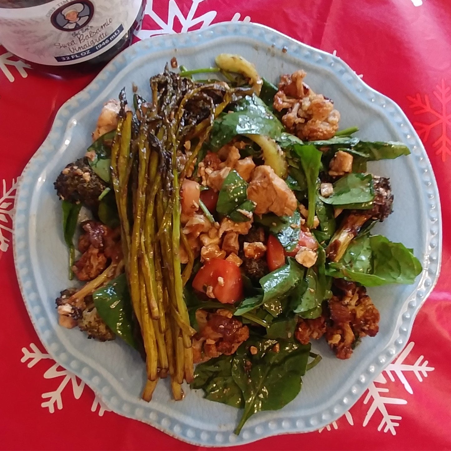 Plated dish of greens and vegetables on a red tablecloth with a bottle in the corner.  Asparagus and salad tossed with Chef Tim's Sweet Balsamic Vinaigrette salad dressing and marinade.  Made with 7 natural Ingredients and is Gluten Free & Cholesterol Free & No MSG
 Makes a Great as a Gift for people who love to cook and desire to eat healthy, and/or gluten free.  Made in USA.
"Shake, Shake, Shake. Don't Refrigerate"©