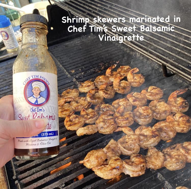 Shrimp skewers on a grill with a bottle of Chef Tim's Sweet Balsamic Vinaigrette tossed with Chef Tim's Sweet Balsamic Vinaigrette salad dressing and marinade.  Made with 7 natural Ingredients and is Gluten Free & Cholesterol Free & No MSG
 Makes a Great as a Gift for people who love to cook and desire to eat healthy, and/or gluten free.  Made in USA.
"Shake, Shake, Shake. Don't Refrigerate"©