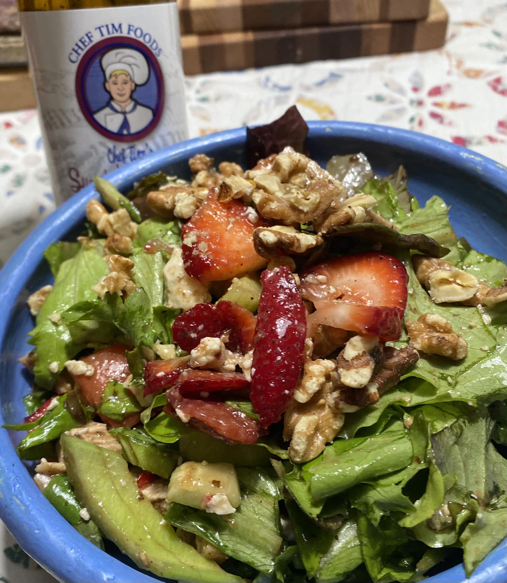 Strawberry Walnut Salad in a blue bowl tossed with Chef Tim's Sweet Balsamic Vinaigrette salad dressing and marinade..  Blue cheese crumbles green leaf lettuce.  Made with 7 natural Ingredients and is Gluten Free & Cholesterol Free & No MSG
 Makes a Great as a Gift for people who love to cook and desire to eat healthy, and/or gluten free.  Made in USA.
"Shake, Shake, Shake. Don't Refrigerate"©